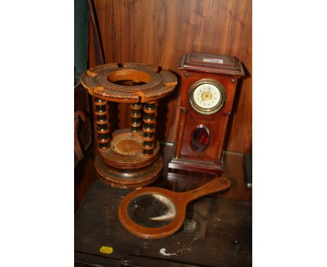 A NOVELTY LONG CASE SHAPED MANTEL CLOCK TOGETHER WITH VINTAGE WOODEN MAGNIFYING GLASS AND A BARLEY TWIST PIPE RACK
