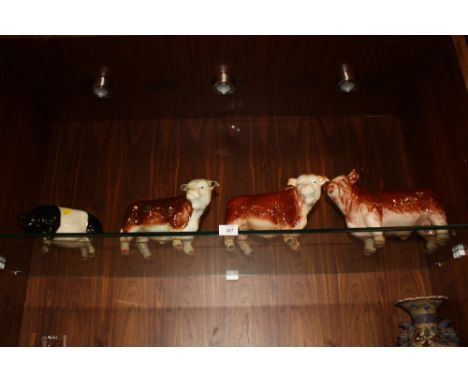 THREE LARGE BUTCHERS SHOP STYLE CERAMIC HEREFORD BULL FIGURES TOGETHER WITH A PIG (4)