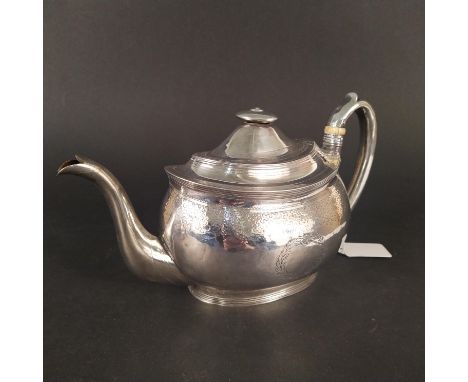 A Georgian silver teapot with engraved decoration, hallmarked London 1804 by Alice and George Burrows II (handle is heavily d