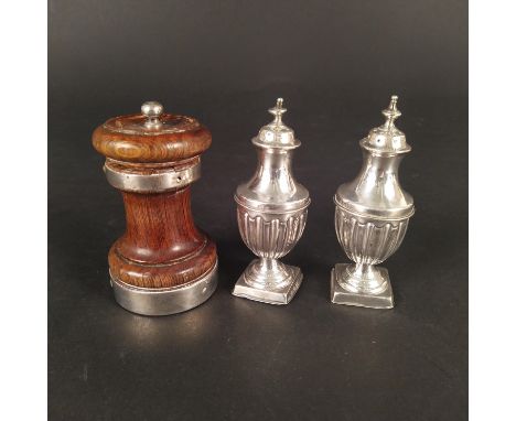 A pair of silver pepperettes with weighted bases, hallmarked Birmingham 1896, makers mark T H, together with a silver banded 