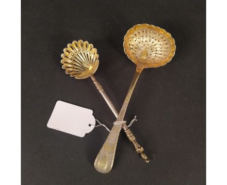 Two silver gilt sifter spoons, the larger with peacock design engraved to bowl and floral decorated handle, hallmarked London