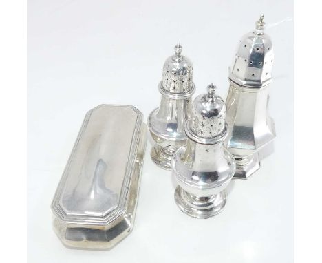 A late Victorian silver table snuff box of rectangular bombe form, together with an early 20th century silver pedestal pepper