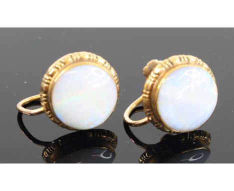 A pair of 9ct gold and opal cabochon set ear clips on screw-back fittings, dia.12mm, 4g