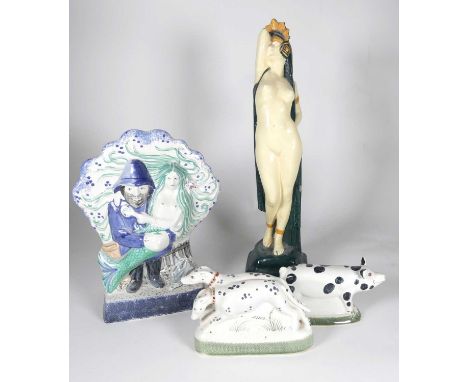 A Rye Pottery 'The Fisherman's Tale' figure depicting a mermaid in the arms of a fisherman together with three other firgures