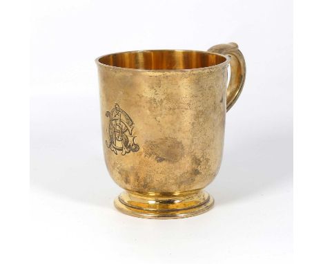 A Victorian silver gilt christening tankard, of pedestal form, having a scroll handle, with engraved initial cypher, maker R 