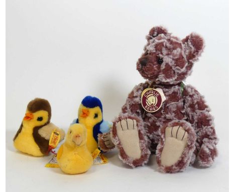 A Steiff chick, having button and yellow label to left wing, h.9cm; together with another and a Steiff duckling; and a Charli