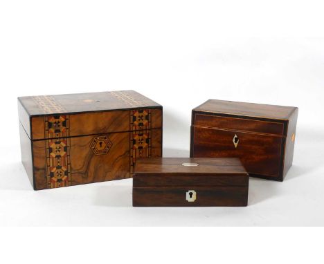 A Victorian rosewood writing box, the hinged cover having shaped rectangular mother of pearl cartouche, opening to reveal a f