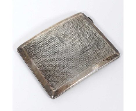 A George V silver cigarette case, of curved hinged recangular form, having engine turned decoartion and a gilt washed interio
