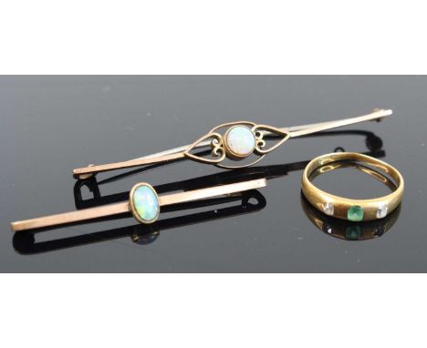 A yellow metal emerald and diamond set half-hoop ring (stones worn), unmarked but tests as approx 18ct gold, size M, 2.2g; to