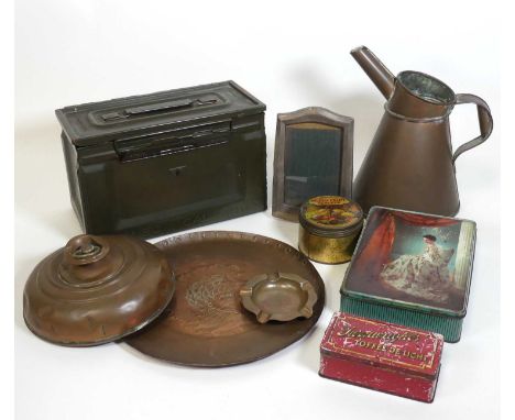 A collection of metalware to include a 50 calibre ammunition box, silver clad easel photograph frame, and various tins 