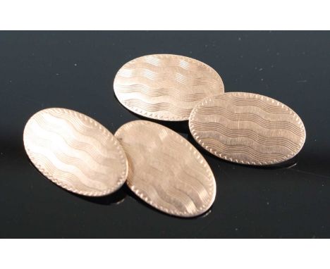 A pair of 9ct gold engine turned cufflinks, 5.8g 