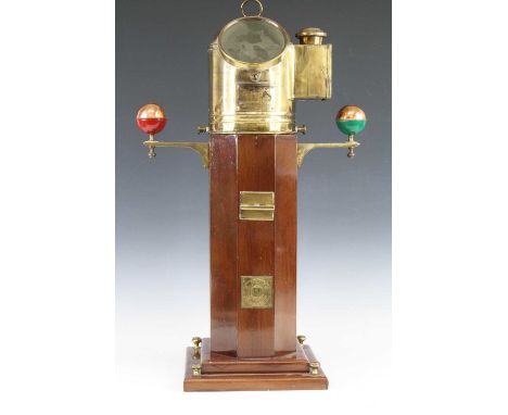 A ships binnacle, having a brass domed cover with observation window to view a gimble mounted liquid filled compass with make