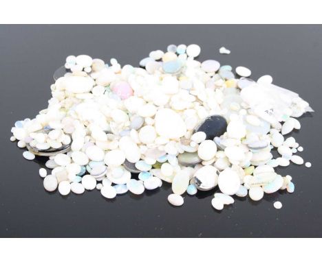 A bag of assorted loose opal cabochons, various sizes, 85g