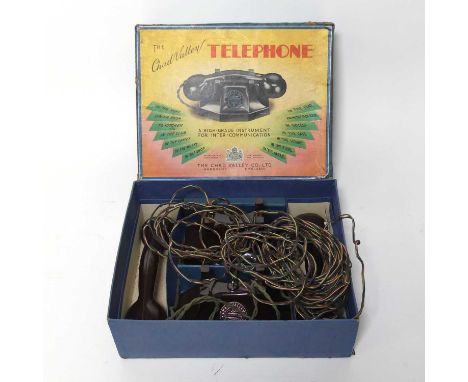 A mid-20th century Chad Valley intercom telephone, boxed
