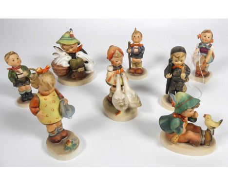 A collection of eight Hummel figuresGirl with basket - chip to base.Boy &amp; rabbit - heavily crazed on base.Girl &amp; goos