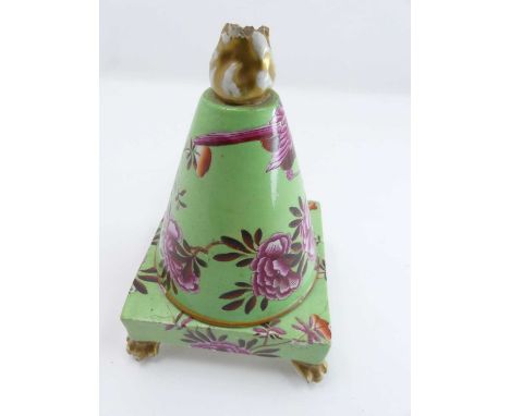 An early 19th century Spode(?) porcelain pastille burner, the finial in the form of a flame above a conical shaped body, with