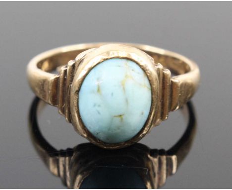 A vintage 9ct gold and turquoise cabochon set ring, Chester assays, size T, 6gCracks to the stone.