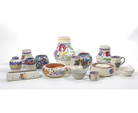 A collection of Poole Pottery, to include a vase of lower bulbous form, decorated with birds amongst flowers, h.17cm; various