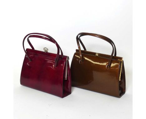 A vintage lady's red vinyl handbag, w.25cm; together with another example in gold 