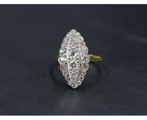 A Victorian diamond navette ring having twenty six stones of various sizes totalling approx 1.5ct in a pave setting with rais