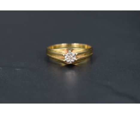 A gent's 9ct gold signet ring having a small inset diamond chip to raised shoulders, size U &amp; approx 4g