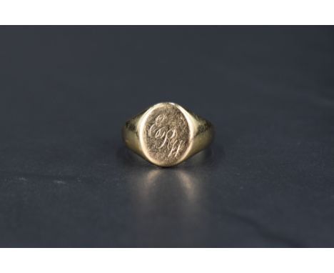 A gent's 9ct gold signet ring bearing monogrammed panel, size R &amp; approx 6.2g