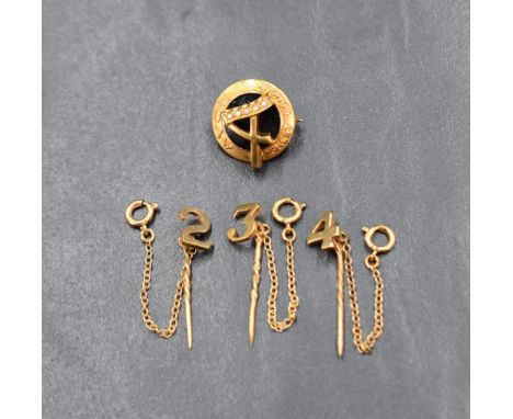 A 9ct gold Avon 'Highest Honour' brooch and three 9ct gold numerical stick pins, approx 5.7g total