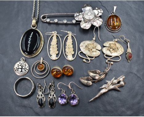 A selection of white metal jewellery, many stamped 925/silver including several pairs of earrings, Baltic amber pendant, broo