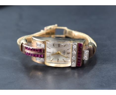 A 9ct gold cocktail watch by Aureole having baton numeral dial to rectangular face with convex glass in diamond and ruby set 