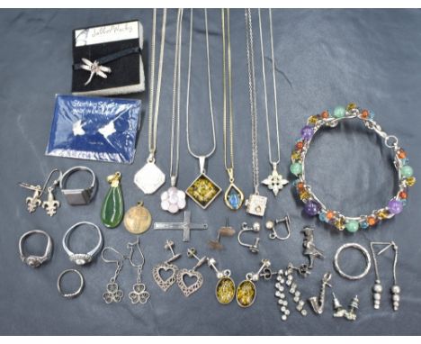 A small selection of silver and white metal jewellery including pendants including Milenium &amp; black opal, earrings, rings