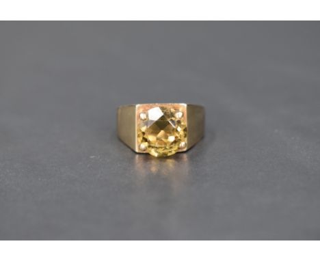 A peridot style single stone solitaire ring, approx 3ct in a 4 claw set open mount on a heavy 9ct gold loop, size N &amp; app