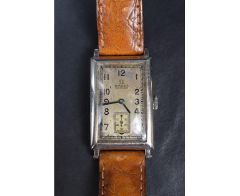 A gent's 1930's manual wind Omega tank cased wrist watch having Arabic numeral dial and subsidiary seconds to silvered dial w