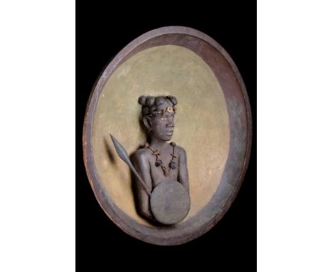 A RARE MADAGASCAN SOUTHERN SAKALAVA PEOPLES PLAQUE EARLY 20TH CENTURY Depicting a warrior with spear and shield wearing a tal