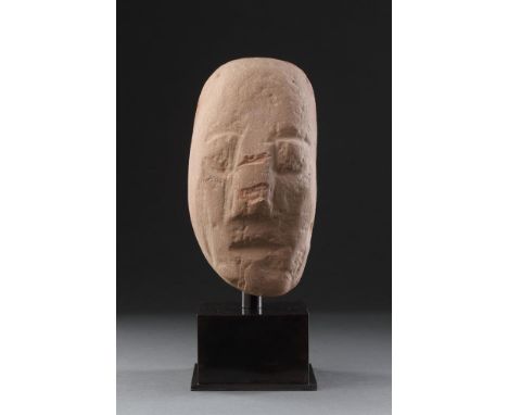 AN ANCIENT BRITISH CELTIC RED SANDSTONE HEAD 1ST CENTURY BC-1ST CENTURY AD  Of unusual shape with a long narrow face striking