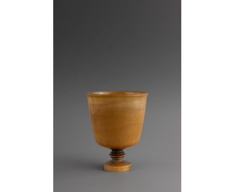 Y  A RARE LARGE GERMAN TURNED BLONDE RHINOCEROS HORN GOBLET  17TH CENTURY  Old smooth silky pale honey coloured patina 15cm h