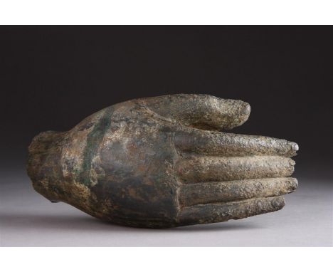 A CAST BRONZE HAND OF THE BUDDHA SHAKYAMUNI  THAILAND/SOUTH EAST ASIAN, 13TH-14TH CENTURY  Shown in the gesture of touching t