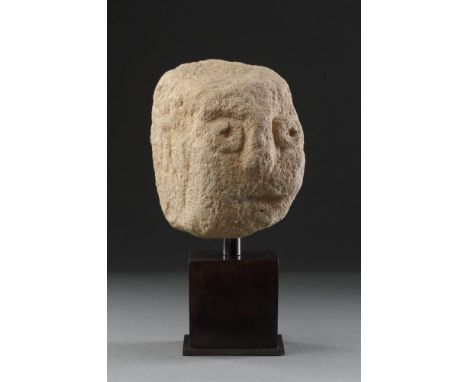 A RARE SMALL ANCIENT BRITISH CELTIC BUFF COLOURED SANDSTONE HEAD  1ST CENTURY BC-1ST CENTURY AD  With dramatic staring pierce