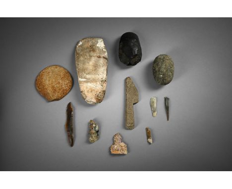 A COLLECTION OF STONE TOOLS TO INCLUDE:  Large flint axe head, possibly Neolithic, 20.5cm long  Black basalt axe head 11cm lo