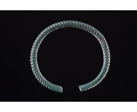 A FINE CELTIC CAST COPPER ALLOY ARM RING WESTERN EUROPE, 8TH CENTURY B.C.  Of thick overall construction, twisted with flatte