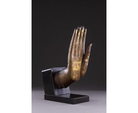 A FINE LARGE GILT BRONZE HAND OF THE BUDDHA SHAKYAMUNI  MING DYNASTY (1368-1644) 16TH CENTURY  With long delicate fingers the