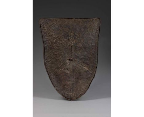 A WORKED LEATHER TRIBAL SHIELD  KENYAN, 19TH CENTURY  91.5cm high, 60.5cm wide  