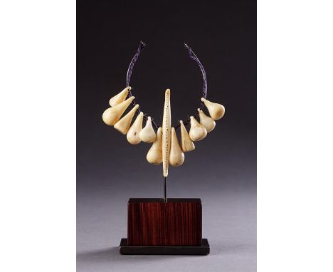 Y&nbsp;TWELVE ESKIMO AMULETIC HUNTING TOGGLES OR PENDANTS INUIT/BERING SEA, 18TH CENTURY OR EARLIER  Walrus ivory with creamy