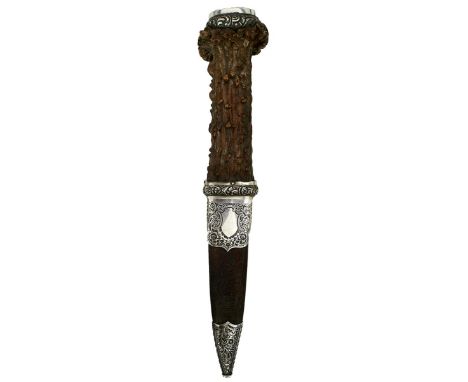 A LARGE WHITE METAL MOUNTED STAG'S HORN SGEAN DUBH, 8cm blade with faceted back edge, large natural stag's horn grip, the top