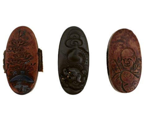 THREE PAIRS OF FUCHI-KASHIRA, the first of copper decorated with huts in shakudo within a landscape, the second of copper eng