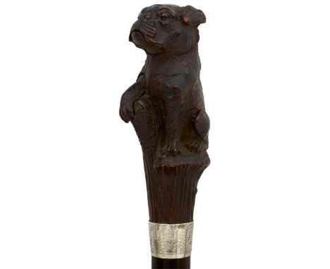 A GOOD LATE 19TH/EARLY 20TH CENTURY WALKING STICK WITH ARTICULATED CARVED WOOD HANDLE IN THE FORM OF A DOG, the dog of bulldo