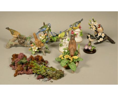 A collection of porcelain model birds, together with an Art Deco press moulded glass lamp base, a pair of Art Deco green glas