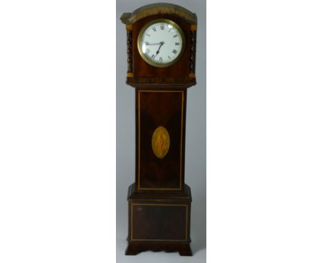 A late 19th century mahogany miniature longcase clock, white enamel 3.5 inch dial marked made in France, the trunk with boxwo