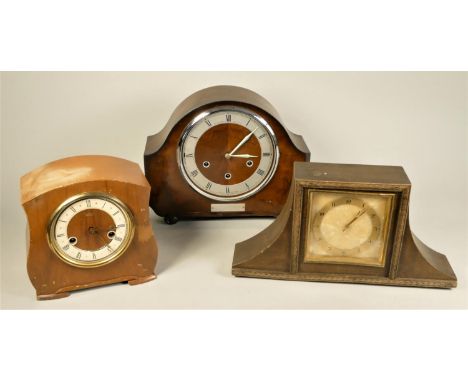 A Smiths Enfield Bakelite manual wind mantle clock together with six other mid Century mantle clocks. (2) 