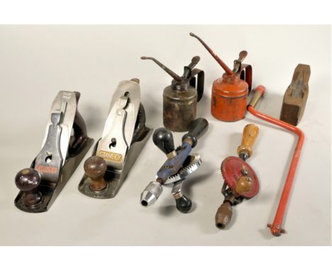 A selection of hand tools to include a Stanley 'Bailey' hand plane No 4, a Stanley Record plane, a Box plane, hand drills and