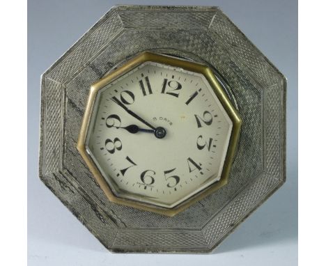 A silver easel desk clock, Chester 1929, of octagonal form with engine turned decoration (spares or repairs)